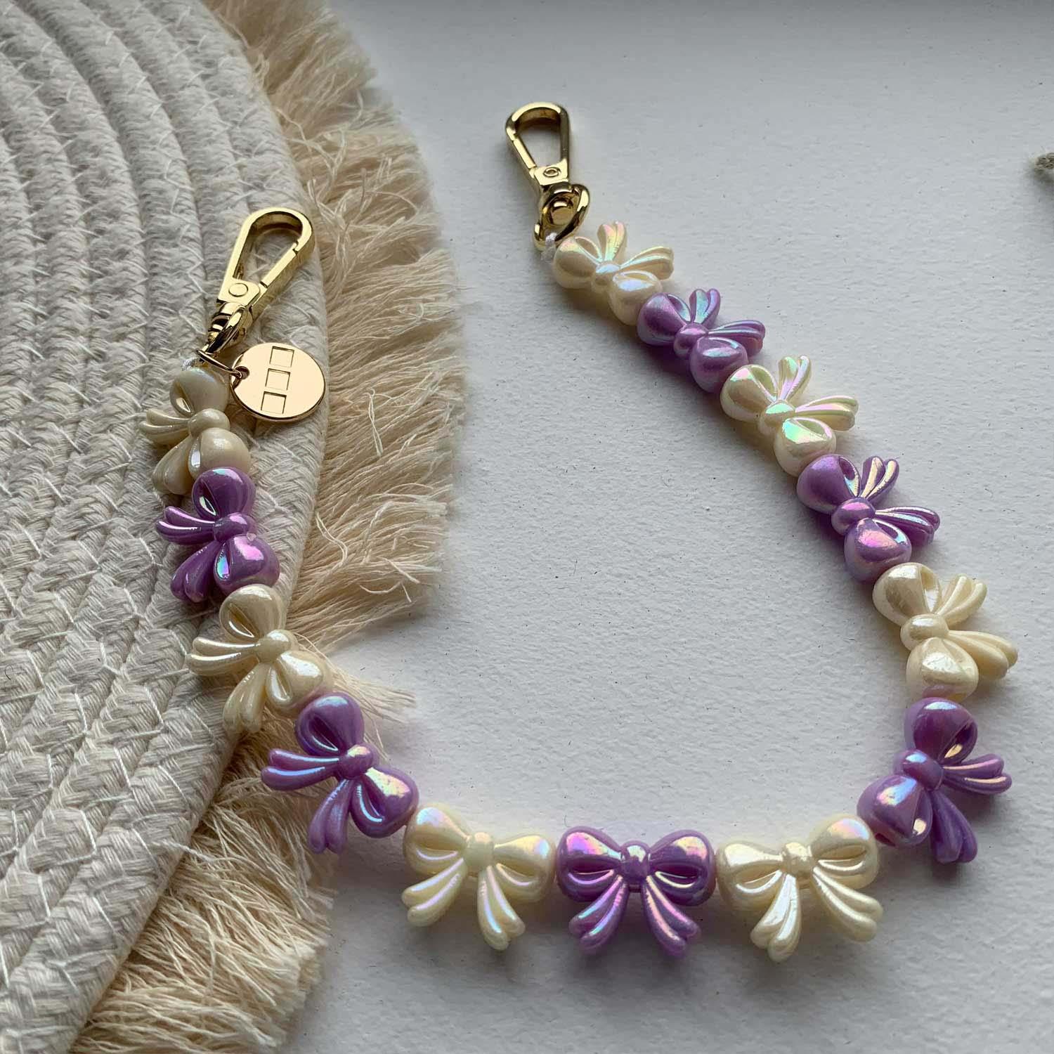Handykette Bow – lila-weiß – gold