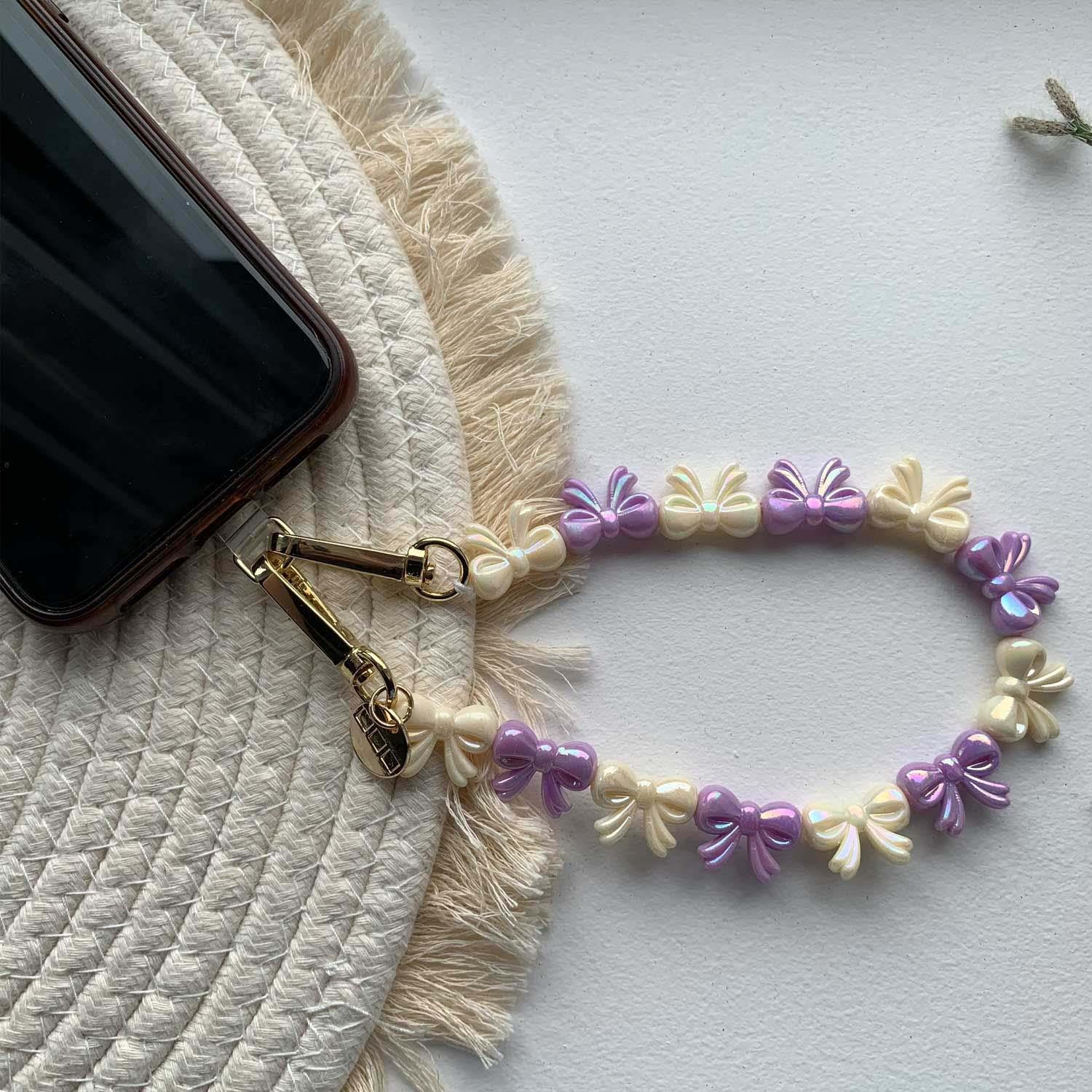 Handykette Bow – lila-weiß – gold